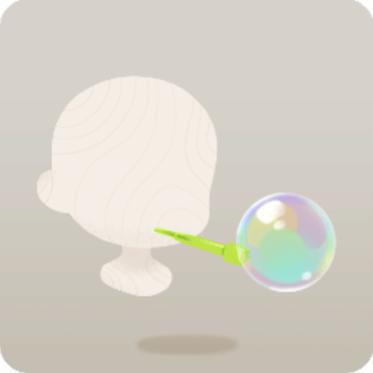 緑色の吹き具とシャボン玉