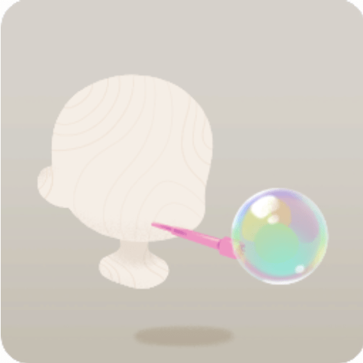 桃色の吹き具とシャボン玉