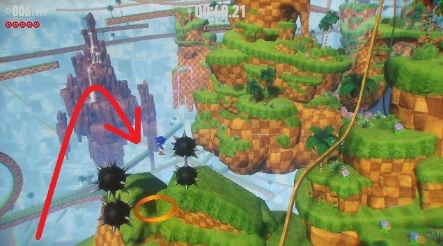 トゲの間を抜けて赤いリングに触れる