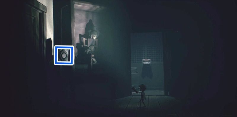 壁のスイッチを弓矢で撃つ