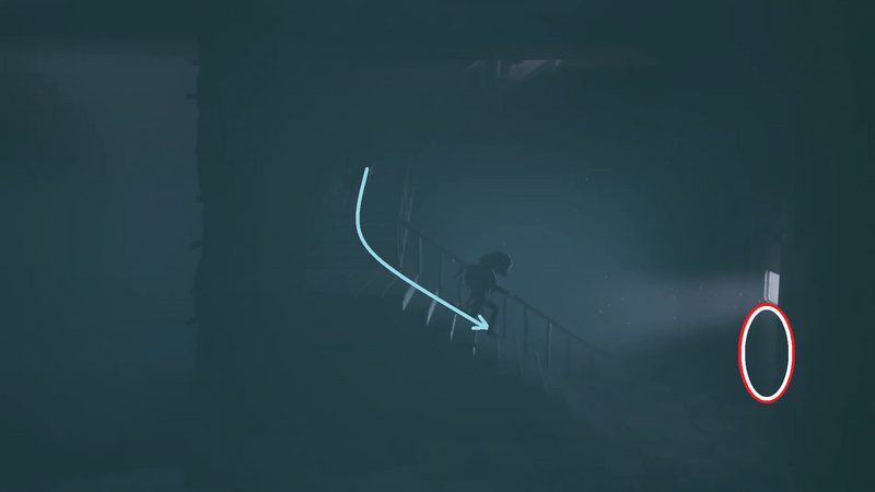 部屋の階段を降りて、ドアに入る