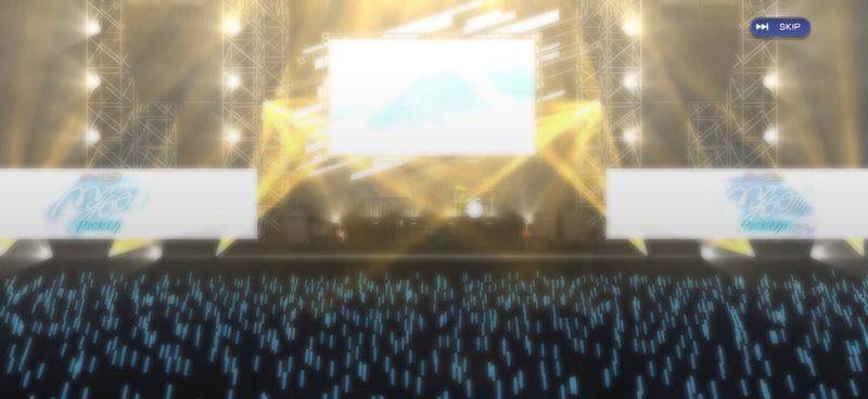客とステージライトが金色